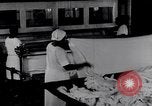 Image of machines iron bed sheets United States USA, 1931, second 24 stock footage video 65675029574