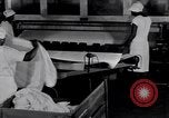 Image of machines iron bed sheets United States USA, 1931, second 33 stock footage video 65675029574