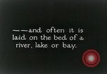 Image of underwater telephone lines United States USA, 1928, second 23 stock footage video 65675029615
