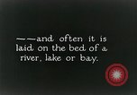Image of underwater telephone lines United States USA, 1928, second 27 stock footage video 65675029615