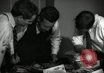Image of Time journalists sort pictures New York City USA, 1939, second 21 stock footage video 65675029699