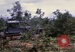 Image of clearing vegetation Bein Hoa South Vietnam, 1967, second 47 stock footage video 65675029758