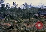 Image of clearing vegetation Bein Hoa South Vietnam, 1967, second 55 stock footage video 65675029758
