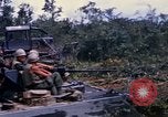 Image of clearing vegetation Bein Hoa South Vietnam, 1967, second 58 stock footage video 65675029758