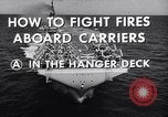 Image of aircraft carrier fire fighting United States USA, 1960, second 11 stock footage video 65675029807