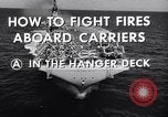 Image of aircraft carrier fire fighting United States USA, 1960, second 12 stock footage video 65675029807