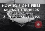 Image of aircraft carrier fire fighting United States USA, 1960, second 13 stock footage video 65675029807