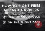 Image of aircraft carrier fire fighting United States USA, 1960, second 15 stock footage video 65675029807