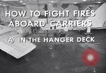 Image of aircraft carrier fire fighting United States USA, 1960, second 17 stock footage video 65675029807
