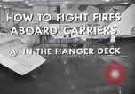 Image of aircraft carrier fire fighting United States USA, 1960, second 18 stock footage video 65675029807