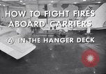Image of aircraft carrier fire fighting United States USA, 1960, second 19 stock footage video 65675029807