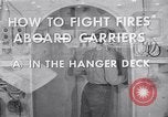 Image of aircraft carrier fire fighting United States USA, 1960, second 20 stock footage video 65675029807
