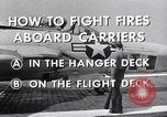 Image of controlling deck fire United States USA, 1960, second 4 stock footage video 65675029808