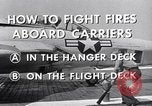 Image of controlling deck fire United States USA, 1960, second 9 stock footage video 65675029808