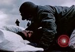 Image of Chaplain prays over wounded sailor Japan, 1945, second 19 stock footage video 65675029821
