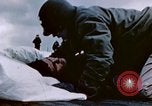 Image of Chaplain prays over wounded sailor Japan, 1945, second 20 stock footage video 65675029821
