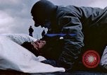 Image of Chaplain prays over wounded sailor Japan, 1945, second 21 stock footage video 65675029821