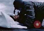 Image of Chaplain prays over wounded sailor Japan, 1945, second 22 stock footage video 65675029821