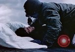 Image of Chaplain prays over wounded sailor Japan, 1945, second 23 stock footage video 65675029821