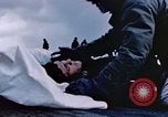 Image of Chaplain prays over wounded sailor Japan, 1945, second 25 stock footage video 65675029821