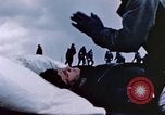 Image of Chaplain prays over wounded sailor Japan, 1945, second 26 stock footage video 65675029821