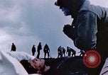 Image of Chaplain prays over wounded sailor Japan, 1945, second 28 stock footage video 65675029821