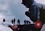 Image of Chaplain prays over wounded sailor Japan, 1945, second 29 stock footage video 65675029821