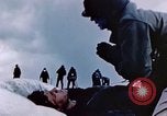 Image of Chaplain prays over wounded sailor Japan, 1945, second 32 stock footage video 65675029821