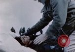 Image of Chaplain prays over wounded sailor Japan, 1945, second 43 stock footage video 65675029821