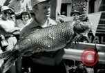Image of carp fishing contest Michigan United States USA, 1956, second 37 stock footage video 65675029895