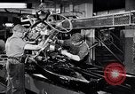 Immagine di Assemblare le parti di ricambio delle automobili Michigan United States USA, 1938, secondo 6 filmato di repertorio 65675029998