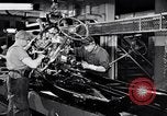 Immagine di Assemblare le parti di ricambio delle automobili Michigan United States USA, 1938, secondo 7 filmato di repertorio 65675029998