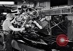 Immagine di Assemblare le parti di ricambio delle automobili Michigan United States USA, 1938, secondo 8 filmato di repertorio 65675029998