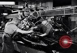 Immagine di Assemblare le parti di ricambio delle automobili Michigan United States USA, 1938, secondo 14 filmato di repertorio 65675029998