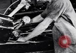 Immagine di Assemblare le parti di ricambio delle automobili Michigan United States USA, 1938, secondo 19 filmato di repertorio 65675029998