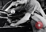 Immagine di Assemblare le parti di ricambio delle automobili Michigan United States USA, 1938, secondo 21 filmato di repertorio 65675029998