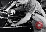 Immagine di Assemblare le parti di ricambio delle automobili Michigan United States USA, 1938, secondo 22 filmato di repertorio 65675029998