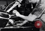 Immagine di Assemblare le parti di ricambio delle automobili Michigan United States USA, 1938, secondo 27 filmato di repertorio 65675029998
