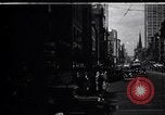 Image of busy city street with pedestrian traffic Detroit Michigan USA, 1926, second 1 stock footage video 65675030056