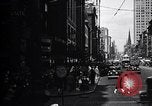 Image of busy city street with pedestrian traffic Detroit Michigan USA, 1926, second 3 stock footage video 65675030056