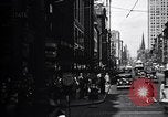 Image of busy city street with pedestrian traffic Detroit Michigan USA, 1926, second 4 stock footage video 65675030056
