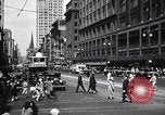 Image of busy city street with pedestrian traffic Detroit Michigan USA, 1926, second 14 stock footage video 65675030056