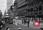 Image of busy city street with pedestrian traffic Detroit Michigan USA, 1926, second 15 stock footage video 65675030056