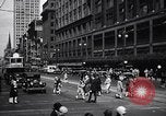 Image of busy city street with pedestrian traffic Detroit Michigan USA, 1926, second 16 stock footage video 65675030056