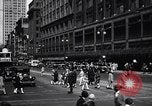 Image of busy city street with pedestrian traffic Detroit Michigan USA, 1926, second 17 stock footage video 65675030056