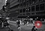 Image of busy city street with pedestrian traffic Detroit Michigan USA, 1926, second 18 stock footage video 65675030056