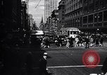 Image of busy city street with pedestrian traffic Detroit Michigan USA, 1926, second 22 stock footage video 65675030056