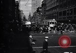 Image of busy city street with pedestrian traffic Detroit Michigan USA, 1926, second 23 stock footage video 65675030056
