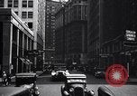 Image of busy city street with pedestrian traffic Detroit Michigan USA, 1926, second 54 stock footage video 65675030056