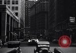 Image of busy city street with pedestrian traffic Detroit Michigan USA, 1926, second 55 stock footage video 65675030056